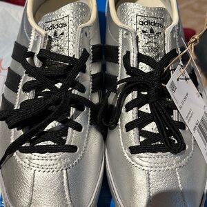New.  Adidas SL72 metallic sneakers.